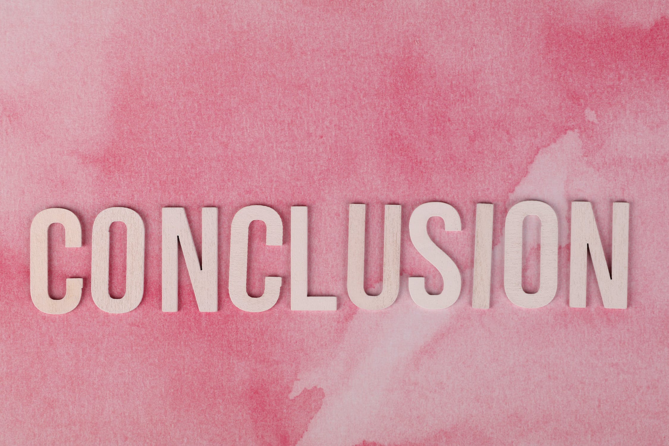 conclusion sign on pink background